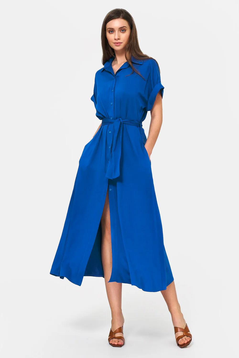 Model wearing a blue fitted dress
