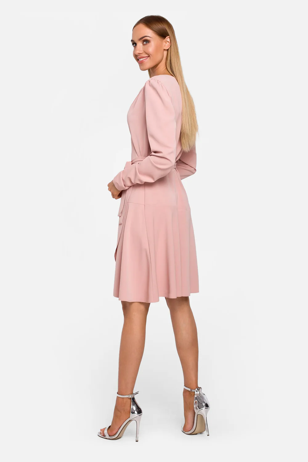 Back view of the powder pink dress tied at the waist